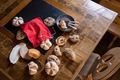 a table with a bunch of different types of donuts at Hotel Goldener Adler in Ischgl