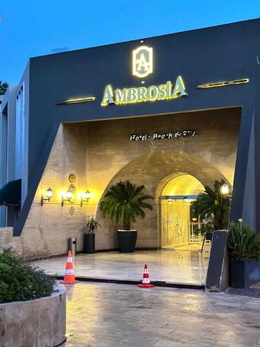 a building with an entrance to anolisula with orange cones at Ambrosia Hotel Beach & Spa in Bitez