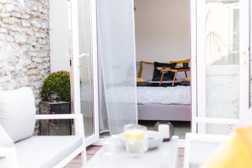 a room with a glass door leading to a bedroom at Luxury Bumblebee Cottage Frome Longleat Aqua Sana Bath DOG FREEndly in Frome