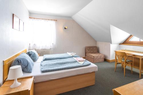 Кровать или кровати в номере Malá Rennerovka