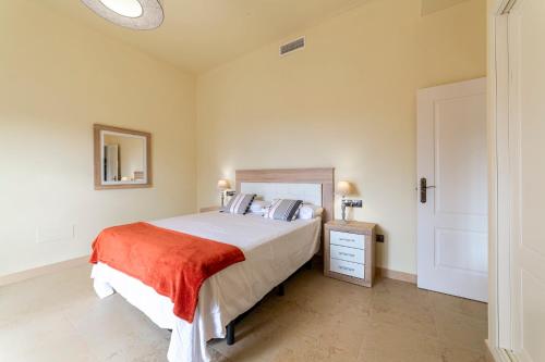 a bedroom with a large bed and a mirror at Trendy Homes Envia Golf I in La Envia