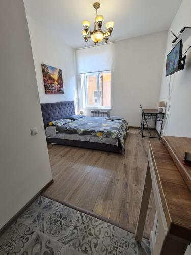a bedroom with a bed and a mirror at Студіо Личаківська 19 in Lviv