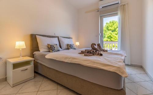 Postel nebo postele na pokoji v ubytování Apartments Rok