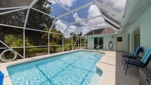 an indoor swimming pool with a large glass ceiling at 26360 Copiapo in Port Charlotte