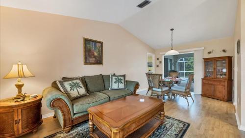 a living room with a couch and a table at 26360 Copiapo in Port Charlotte