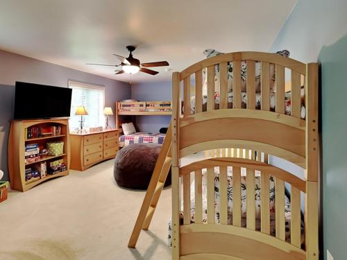 a childs bedroom with a bunk bed and a staircase at Yes Deer in Oakland