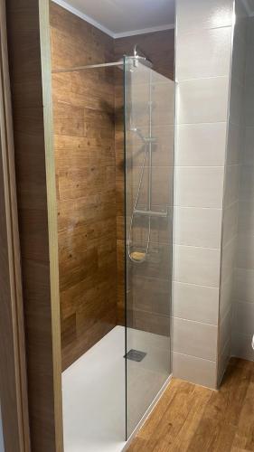 a shower with a glass door in a bathroom at Del Mar 1C - New Beach First floor One bed flat in Puerto de Sagunto