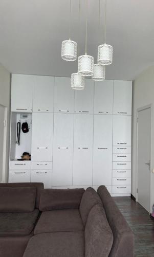 a living room with a couch and white cabinets at Beautiful sea view apartment in Gonio in Gonio