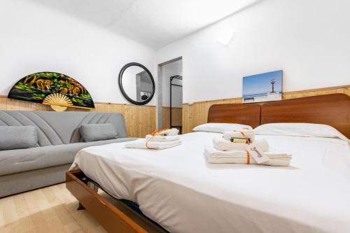 A bed or beds in a room at San Nicola Apartments by Rentbeat