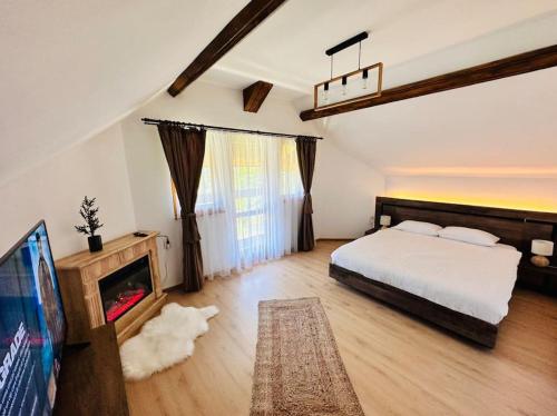 Un pat sau paturi într-o cameră la Hanul Cu Mesteceni