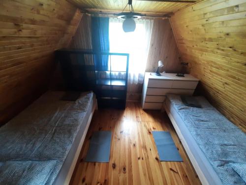 Postel nebo postele na pokoji v ubytování Parisowka w Wielkim Lesie