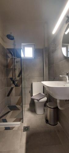 a bathroom with a sink and a toilet at Sea flight in Preveza