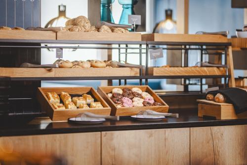 a bakery with several boxes of pastries on a counter at The Gast House Zell am See in Zell am See
