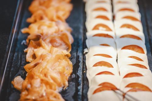 a tray of pastries with caramel and pretzels at The Gast House Zell am See in Zell am See