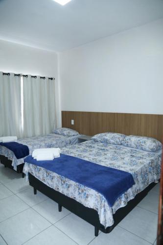 Ένα ή περισσότερα κρεβάτια σε δωμάτιο στο Apartamento excelente Marabá