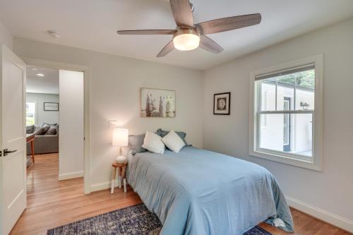 A bed or beds in a room at Raleigh Vacation Rental with Deck, Garden and Backyard