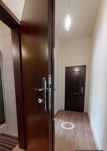a door in a room with a toilet next to it at Pokoje u Margherity in Ińsko