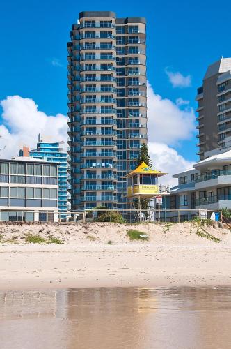 a view of a beach and some buildings at Sunbird Beach Resort Gold Coast in Gold Coast