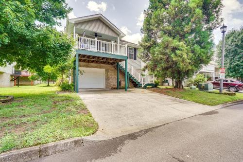 a house with a driveway with a garage at Pigeon Forge Home with Screened Porch, 3 Mi to Town! in Pigeon Forge