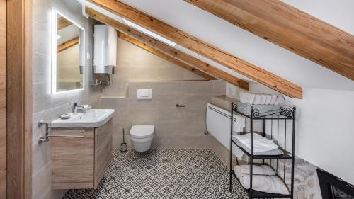 a bathroom with a sink and a toilet at Villa Francesca by Villas Holiday in Umag