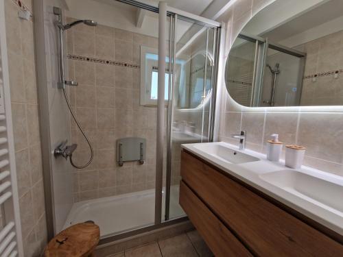 a bathroom with a sink and a shower at Premium Holidays - modern vacation home in a vacation park in Nieuwpoort in Nieuwpoort