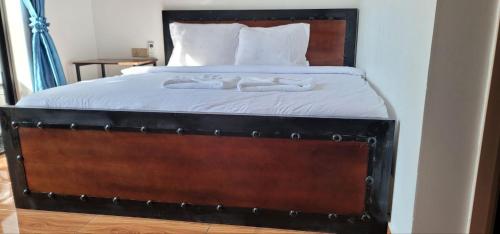 A bed or beds in a room at Park Inn Boutique and Hostel