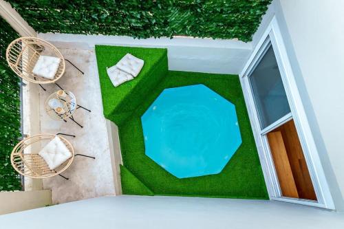 an overhead view of a house with a pool and chairs at 2 Floor apartment with private Pool in Athens