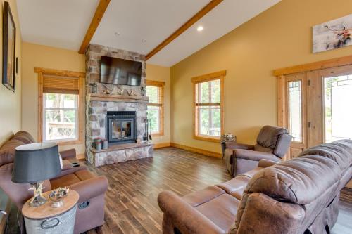 a living room with couches and a fireplace at Tranquil La Prairie Retreat with Patio and Fireplace! in La Prairie
