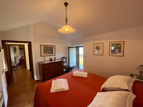 a bedroom with two beds and a sink at Villa Primula in Monti di Pino
