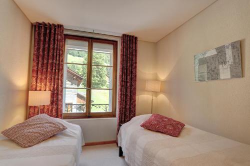 Postel nebo postele na pokoji v ubytování Appartement Rosat 6