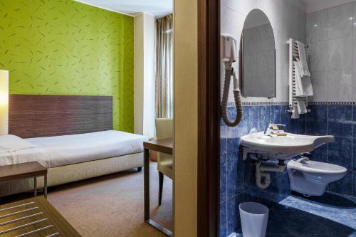 Koupelna v ubytování Hotel Des Etrangers