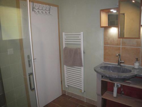 a bathroom with a sink and a mirror at Centre de vacances NatUrsanne in Saint-Ursanne