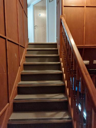 a stairway in a building with a bunch of stairs at EBBERLEY ARMS in Barnstaple