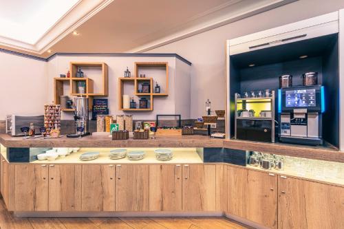 a bar in a store with a counter at Best Western Marseille Aeroport in Vitrolles