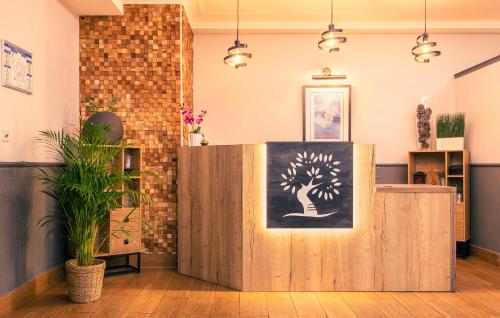 a room with a painting of a tree on the wall at Best Western Marseille Aeroport in Vitrolles