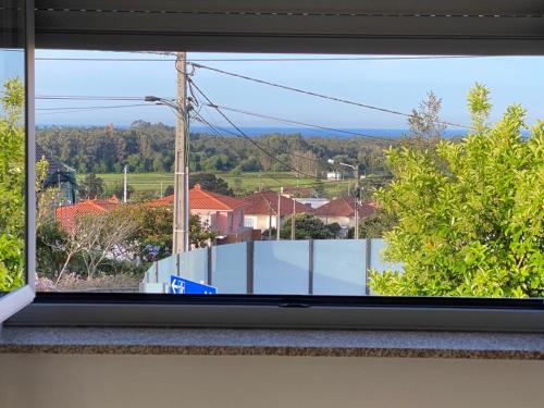 a window with a view of a city at Vivenda Caixilão casa com 3 quartos in Viana do Castelo
