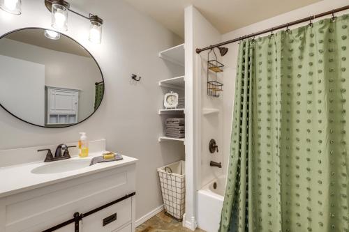 a bathroom with a sink and a shower curtain at Countryside Hideaway in Greeneville with Fire Pit! in Greeneville