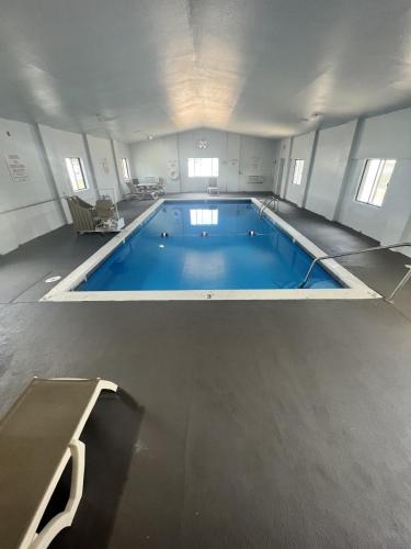 a large swimming pool in a large room at Motel 6-Council Bluffs, IA - Omaha East in Council Bluffs