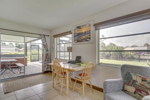 a dining room with a table and chairs at Canalfront Retreat with Heated Pool and Hot Tub! in Port Charlotte