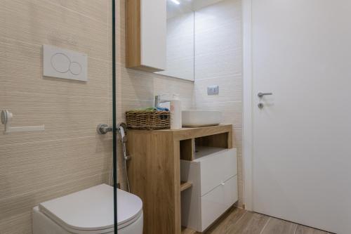 a bathroom with a toilet and a sink at Garden Palace by Wonderful Italy - Apartment in Turin