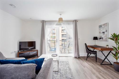 a living room with a couch and a table at Deanery Court Vittrum Suites in Southampton