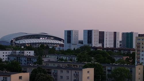 a view of a city with a stadium and buildings at SELF CHECK-IN APARTAMENT LOTNISKO SZPITAL PARKING TARGi in Poznań