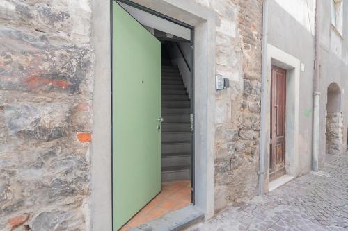 an open door to a stairway with a stair case at La Piazzetta in Iseo