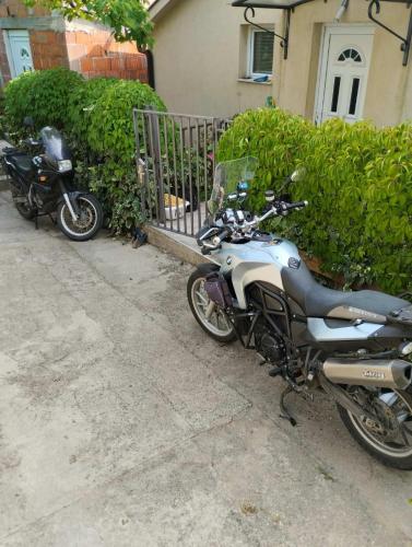 two motorcycles parked in front of a house at Guesthouse Panorama in Mostar