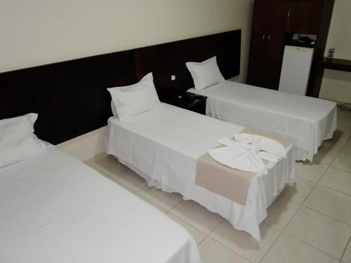 Katil atau katil-katil dalam bilik di Hotel Albinos