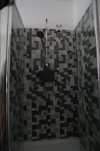 a bathroom with a shower with a toilet at La Suite del Borgo in Bovalino Marina