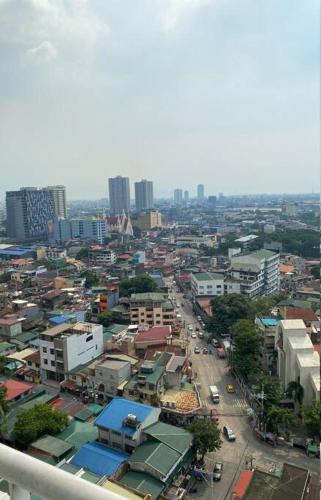 an overhead view of a city with buildings and a street at grass residences tower2 21Floor in Manila
