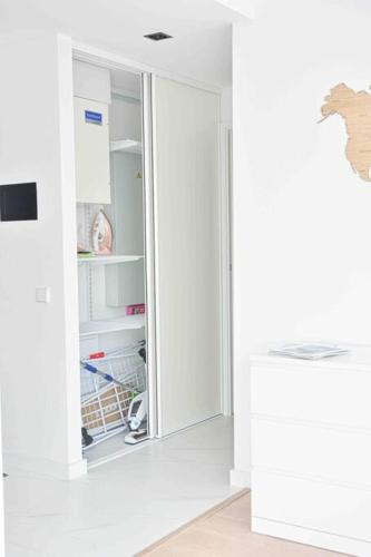 an open refrigerator in a room with white walls at Kalevi Panorama in Tallinn