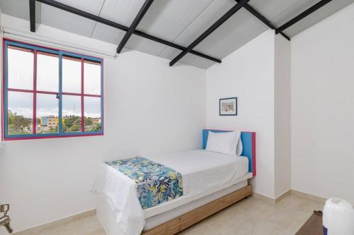 Postel nebo postele na pokoji v ubytování Comodo y amplio apartamento privado-201 Guatape