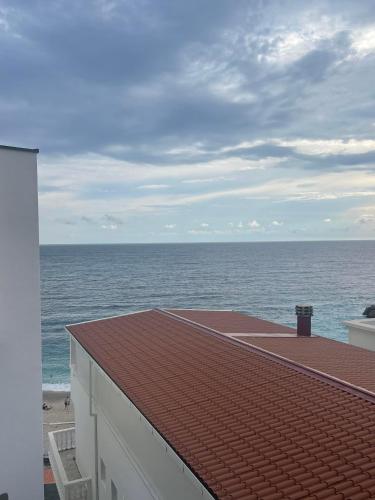 a view of the ocean from the roof of a building at Apart Hotel XXL Lux in Dobra Voda